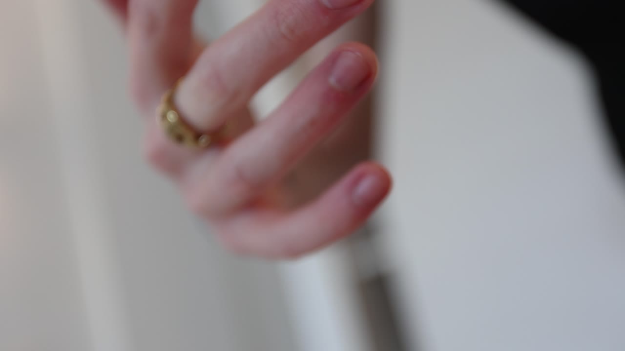 Male Hands Close up putting on jewelry rings gold fashion fashionable style edgy creative hipster