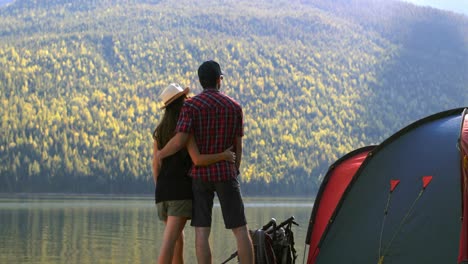 hiker couple standing near riverside 4k
