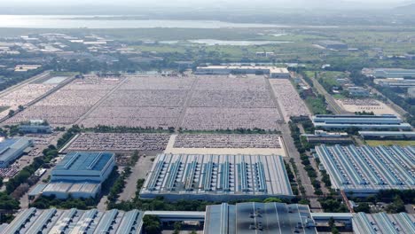 hyundai motor india limited car manufacturing plant and warehouse in sipcot industrial park, rows of cars, chennai, drone shot