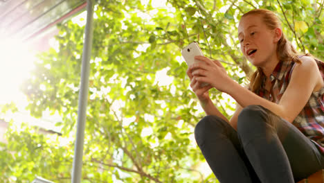 happy schoolgirl talking on mobile phone