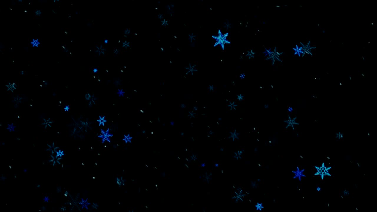 Snowflakes falling on black background.