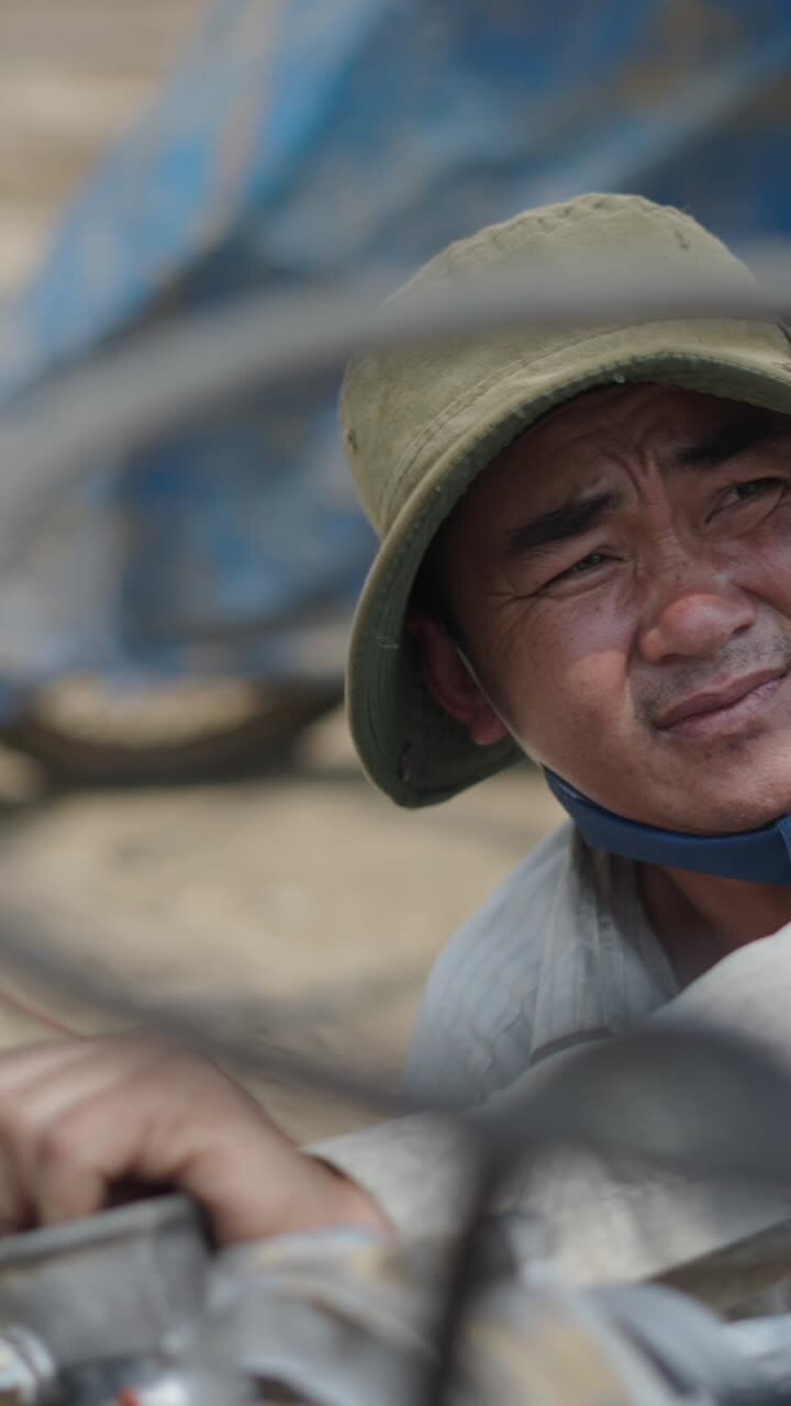 A man wearing a hat and face mask
