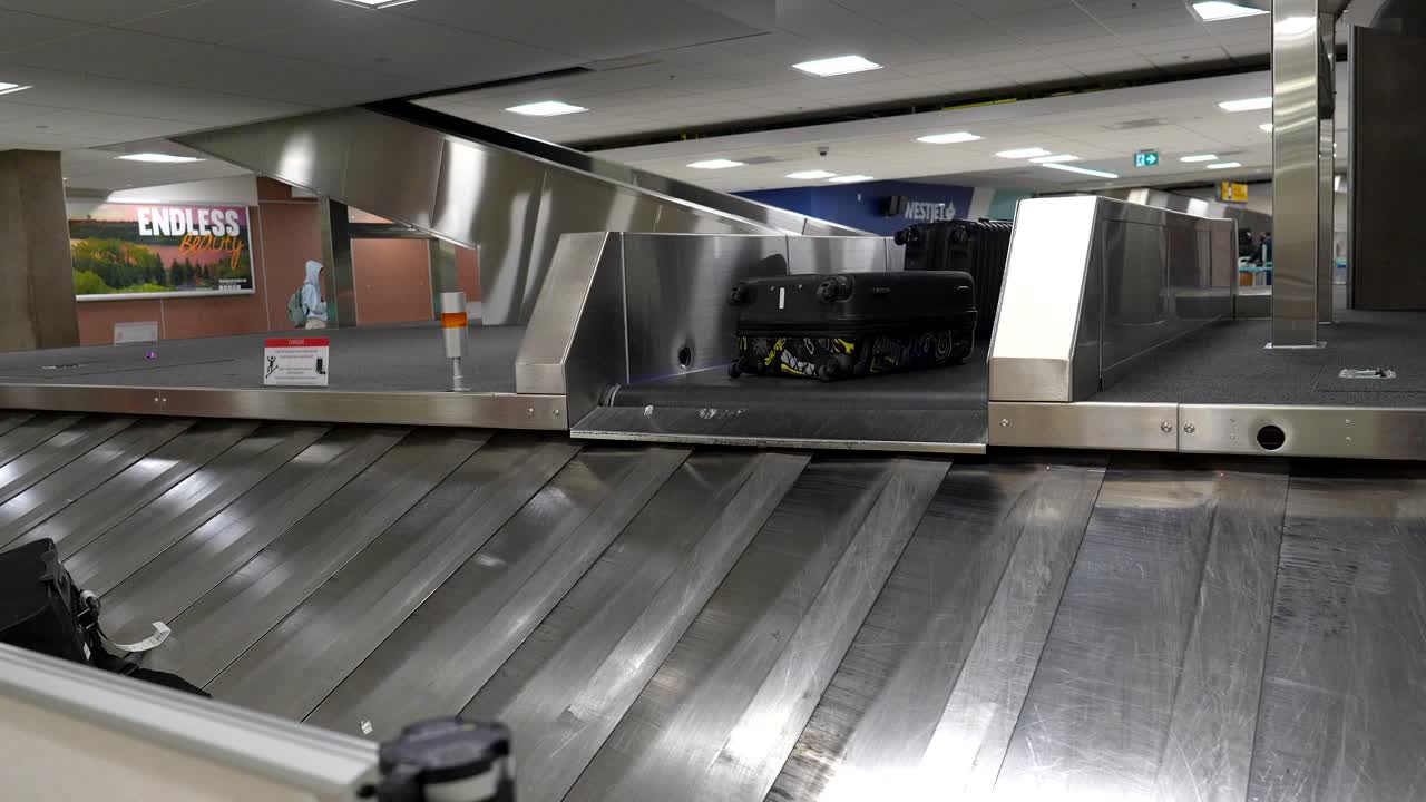 Suitcases on a luggage carousel