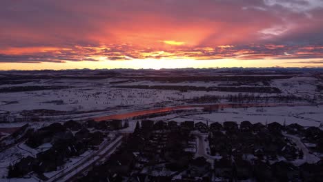 golden hour aerial drone footage of snowy calgary houses