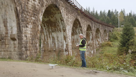 drone inspection of an old stone arch bridge