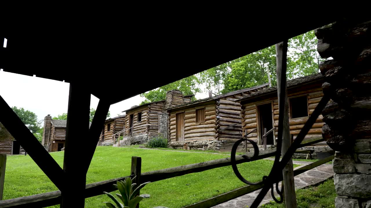 American Frontier cabins at Fort Harrod in Harrodsburg, Kentucky viewed from the blacksmith's shop