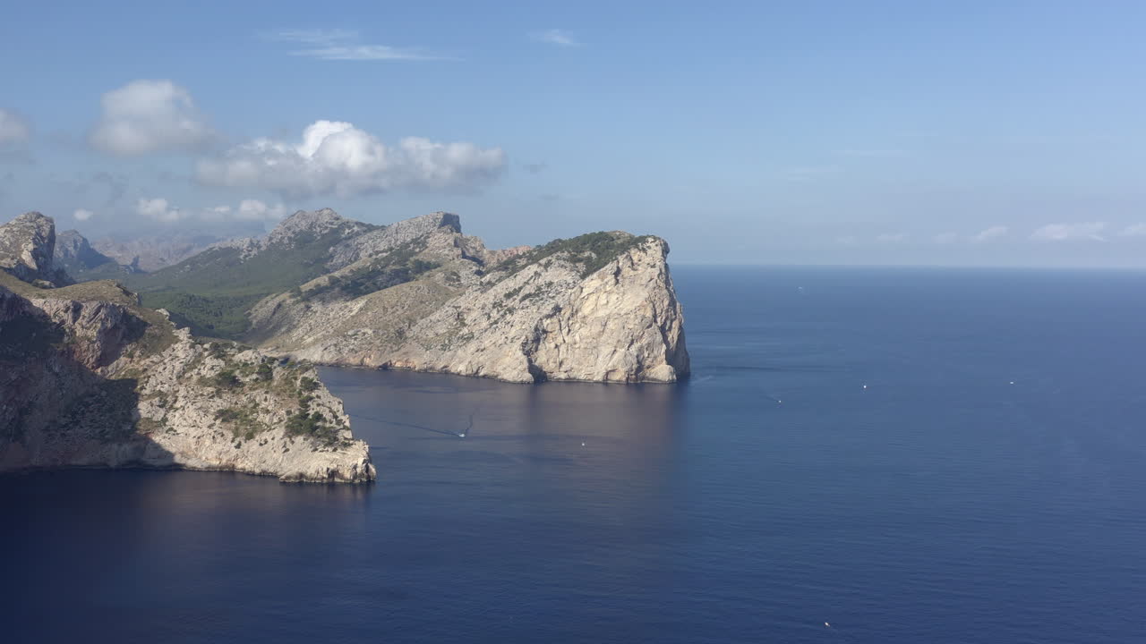 Drone flying towards Punta dells Aucells, Mallorca. Serra de Tramuntana mountains on backround. Aerial footage.