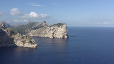 Drone flying towards Punta dells Aucells, Mallorca. Serra de Tramuntana mountains on backround. Aerial footage.