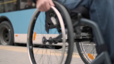 person with a physical disability leaves public transport with an accessible ramp