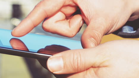 Close-up-hands-touching-tablet-computer