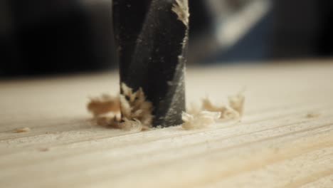 close up static video of drilling on wood plate