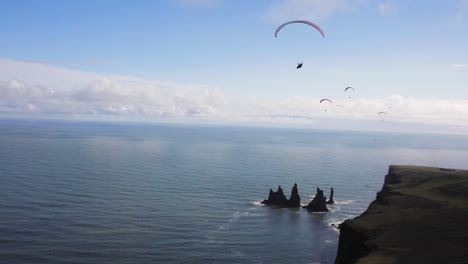 paragliding over icelandic coastline