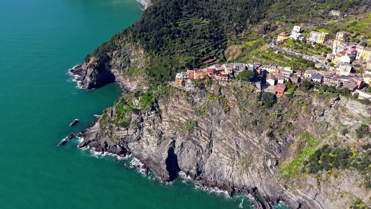 Coastal village of Corniglia in Cinque Terre, Italy, overlooking clear blue sea