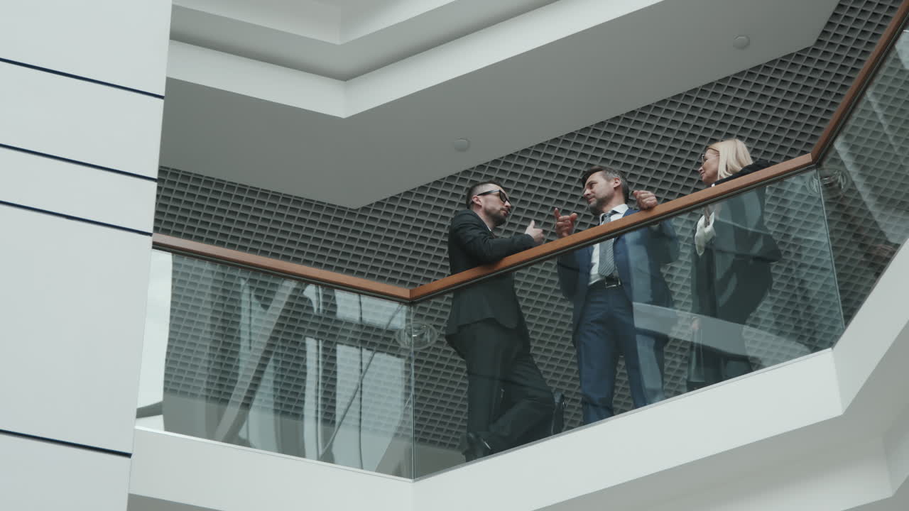 Team of Lawyers Having Conversation in Office