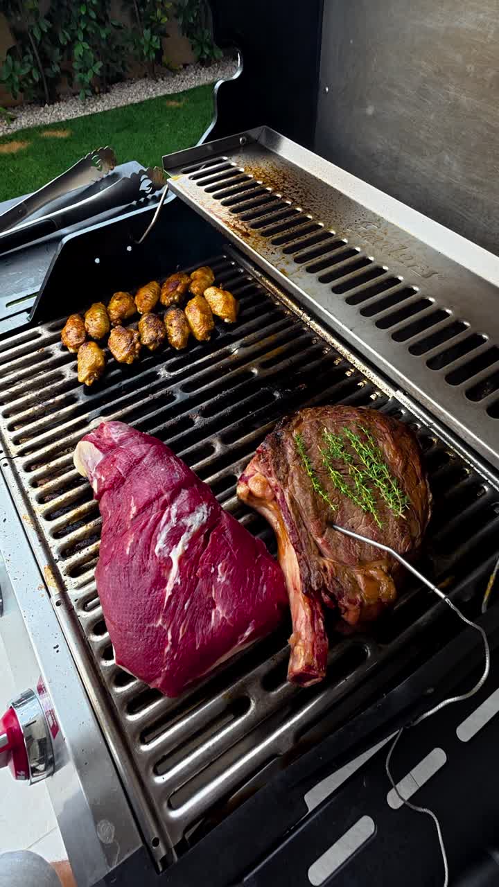 Chicken Wingette And Steaks Cooked Over Flame Grill. - vertical shot