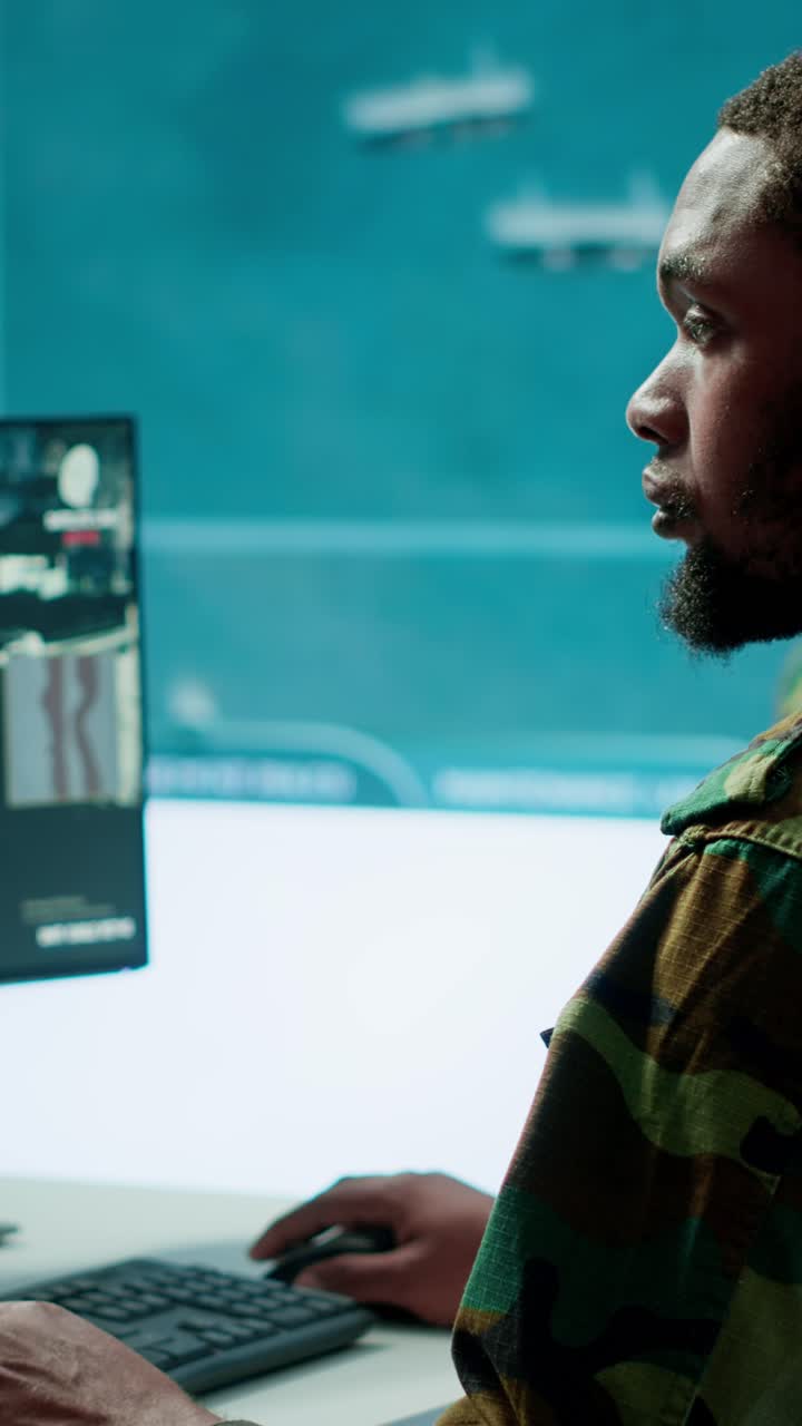 Vertical Video Team of military specialists oversee surveillance activity by using cctv footage