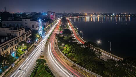 night cityscape with long exposure light trails and water reflections