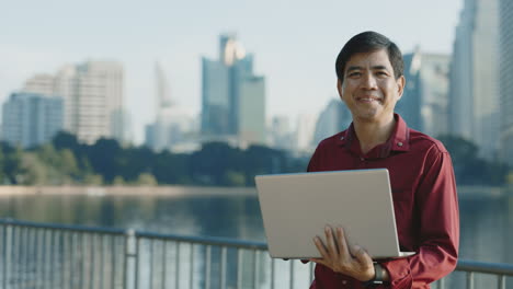 man working on a laptop outdoors