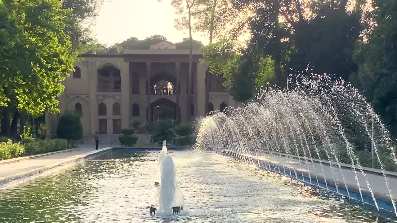 Persian garden in Isfahan Esfahan has historical houses traditional architecture in old palace with fountain pools brick decoration patterns wide landscape pavilion respect of water and sun paradise
