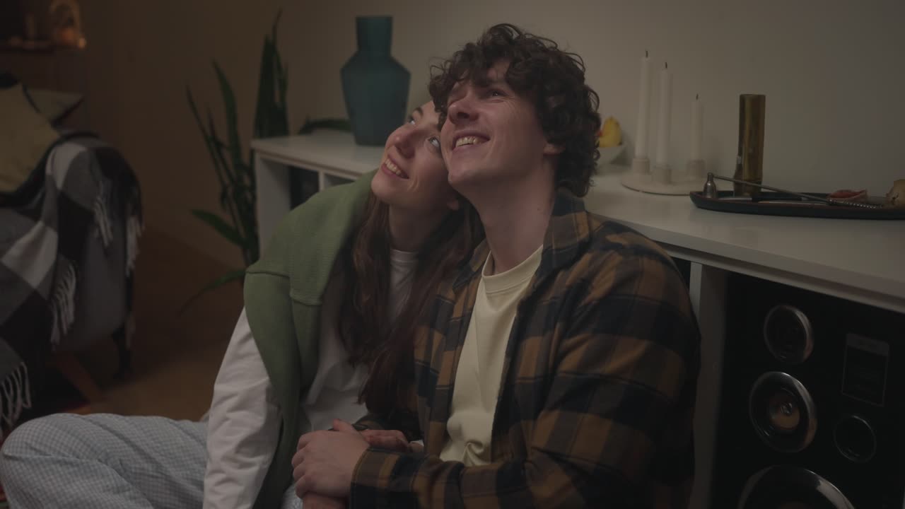 Happy couple spending time together indoors