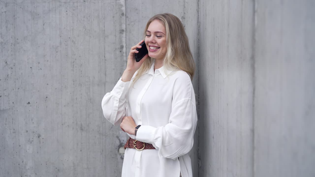Woman Talking on Phone Outside