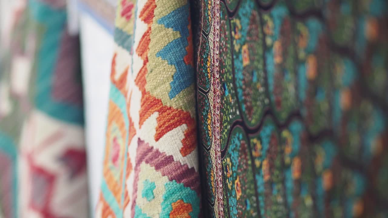 Close-up of Intricate Colorful Patterns on Hanging Fabrics
