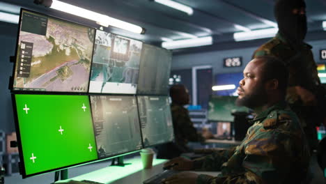 soldier in military hq base using green screen equipment