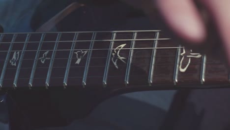 close-up of a person playing an electric guitar