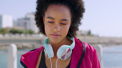 Beach,-headphones-and-face-of-black-woman