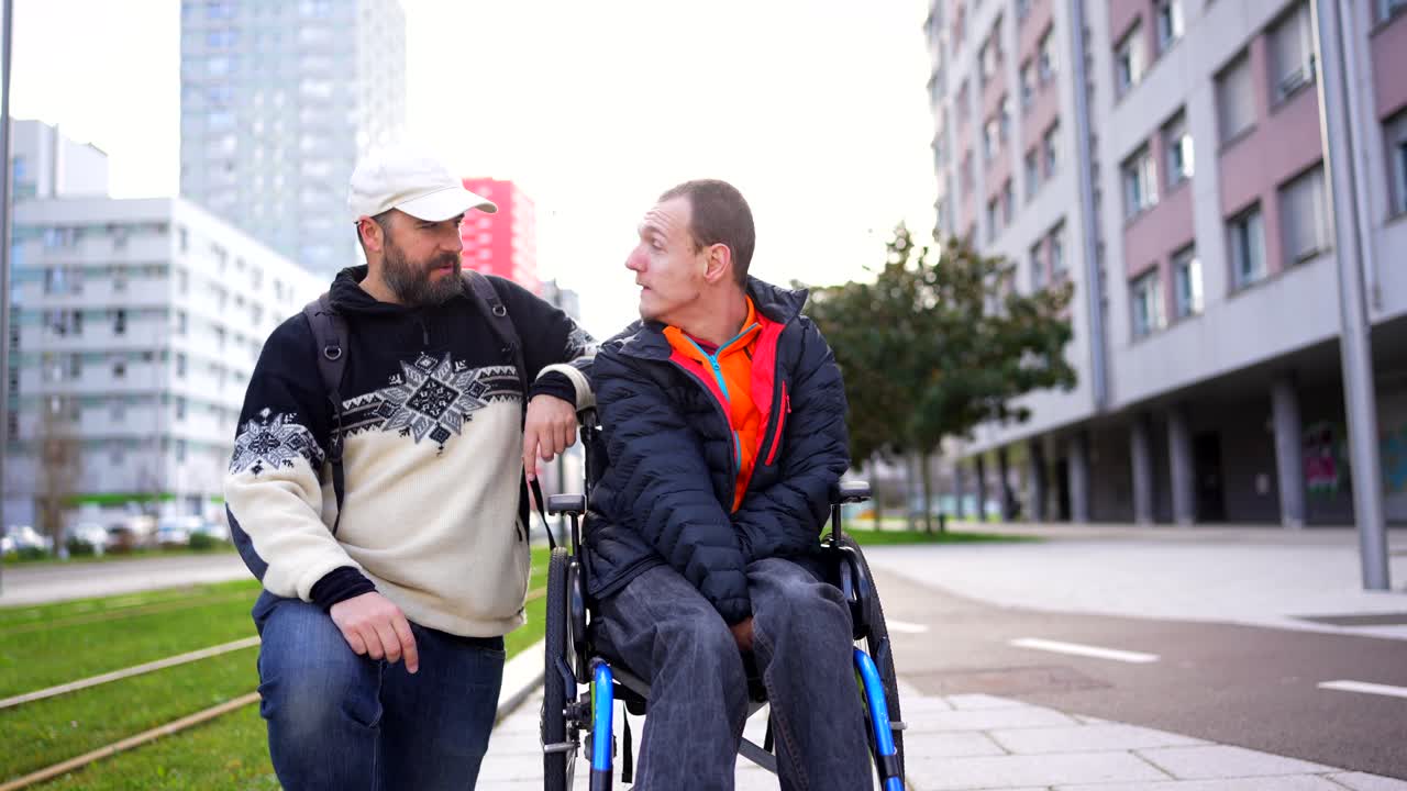 Man Pushing Friend in Wheelchair Outdoors