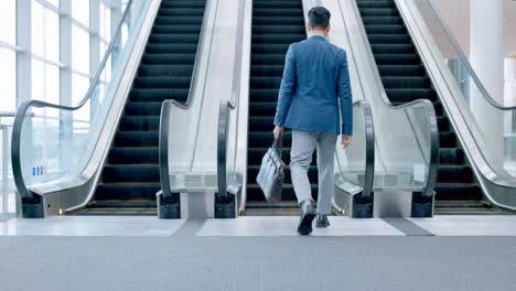 Walking,-businessman-and-escalator-in-office-lobby