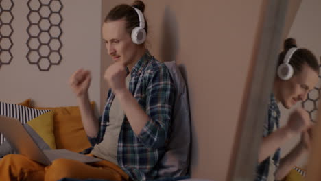 young man in a video call from home