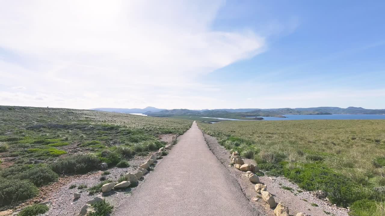 Empty Road Leading to the Sea at Faro de Cavalleria, Menorca