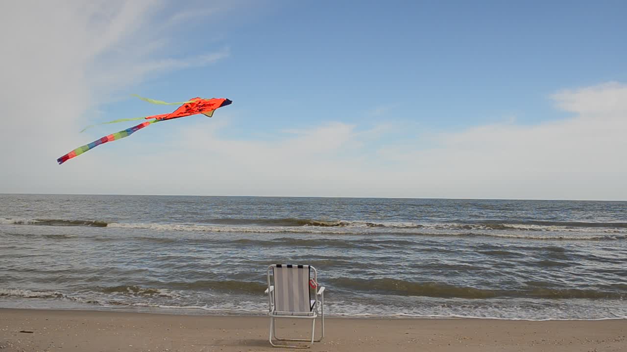 Chaise lounge on the beach, the sea and a kite. Summer Time in Beach Sea Shore