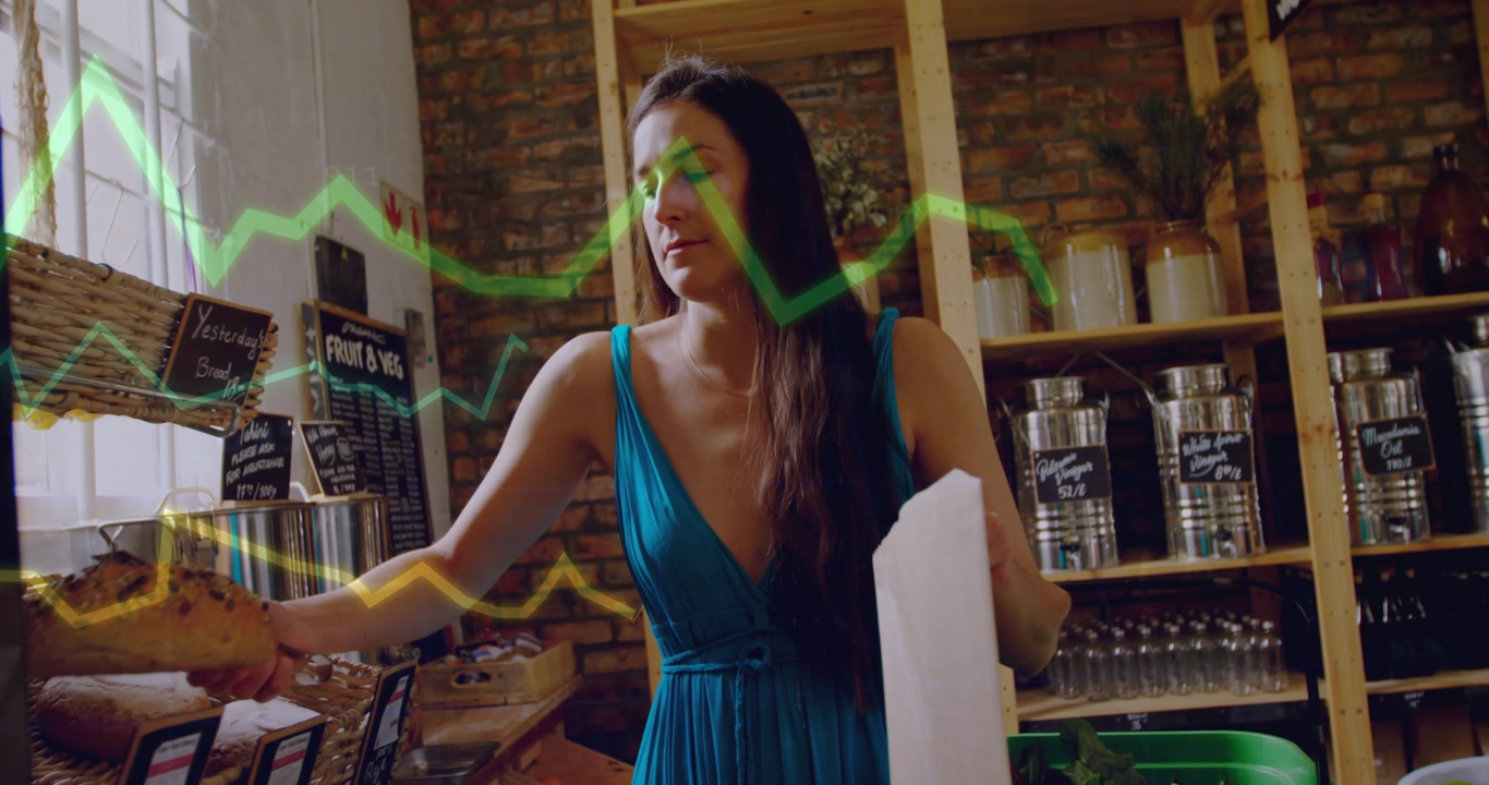 Woman with paper bag reaching bakery bins, selecting loaf to buy while animated graph over frame