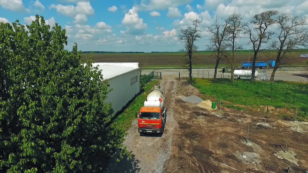 Concrete mixer on construction. Aerial view of concrete mixer truck at construction site
