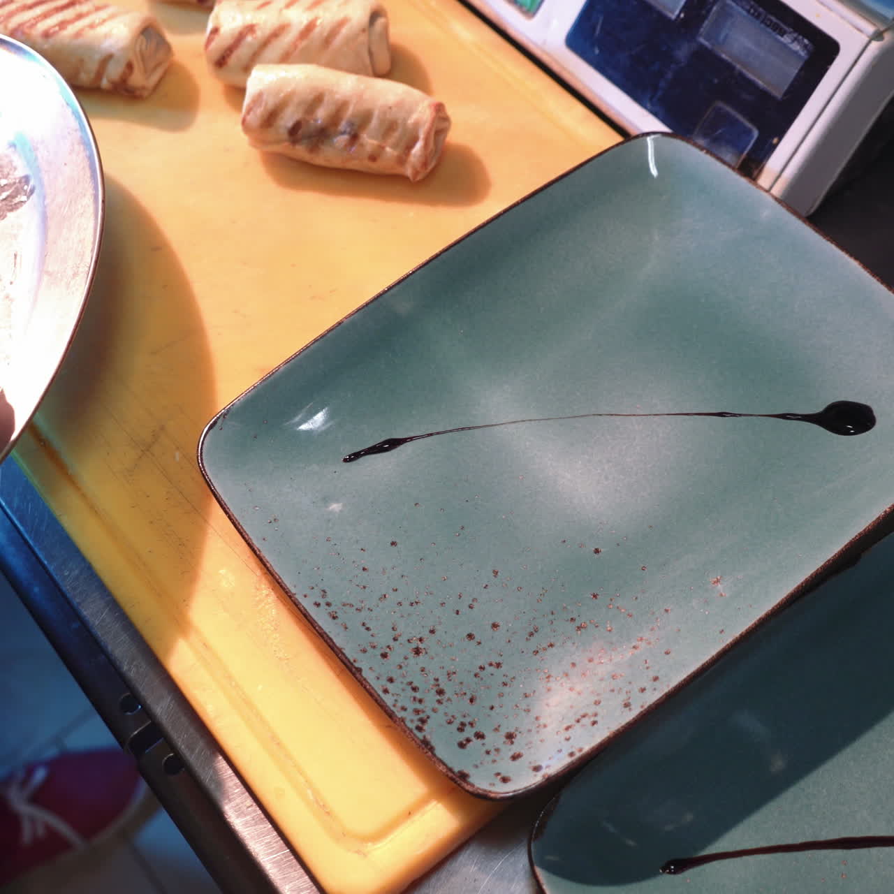 Chef is working on presenting the dish in the commercial kitchen. Rolls pancakes stuffed with meat Sqare video