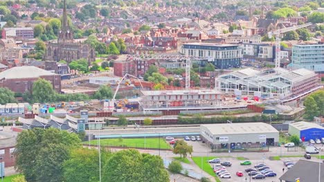 cityscape of rotherham with industrial cranes on constructing sites in south yorkshire, england