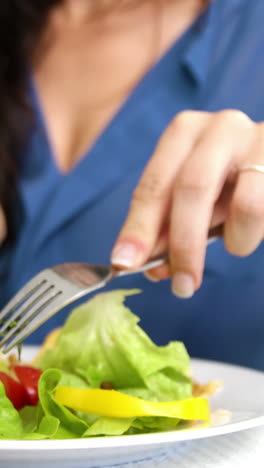 woman eating a fresh meal