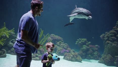 father and son at the aquarium