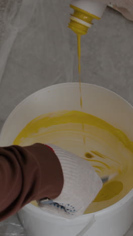 Mixing Yellow Paint for a Painting Project