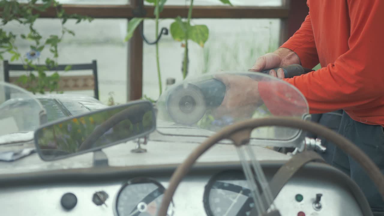 Polishing the aluminium body of a vintage car