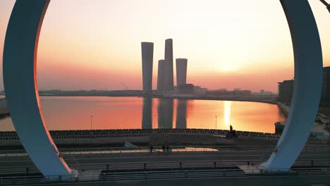 drone shot of lucail towers in qatar at sunset