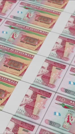 vertical video of 10 guatemalan quetzal banknotes printed by a money press