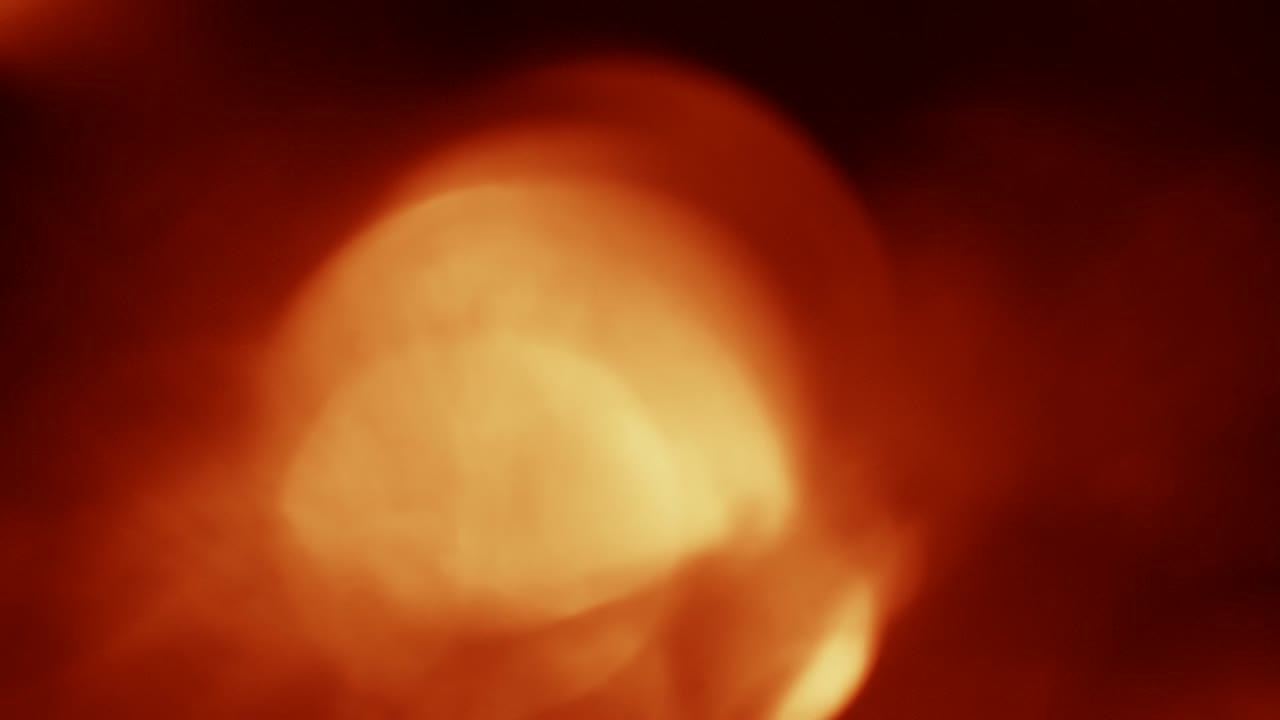 Abstrakti lämmin bokeh-valopilkku- ja valovuototausta
