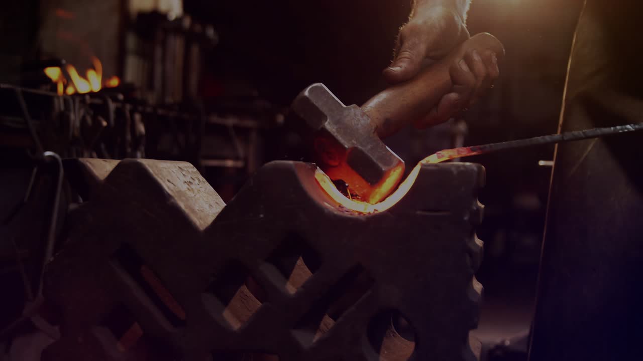 Smith lifting hammer and striking hot curved metal cyan overlay rising and aligning shaping curve