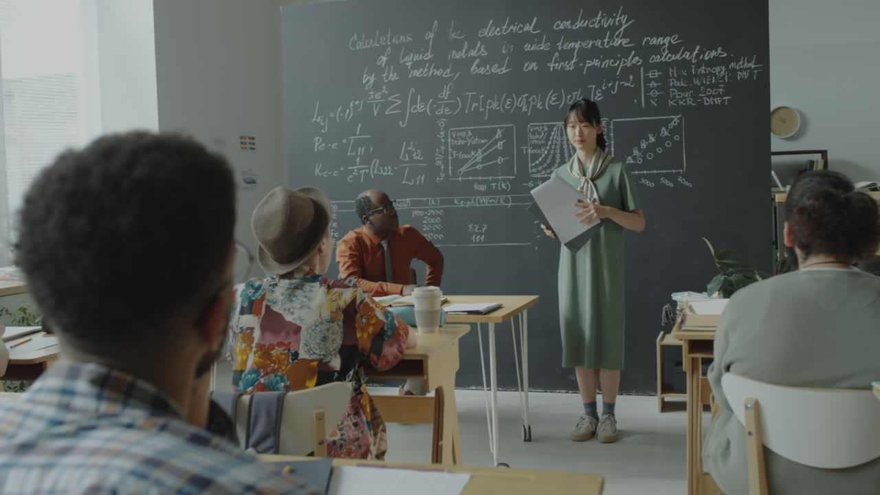 Student presenting complex equations in a science classroom