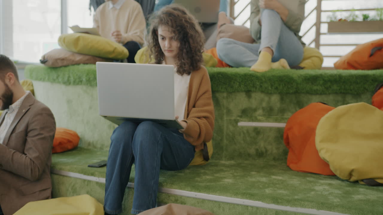 Coworking space with people working on laptops