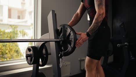 man lifting weights at the gym