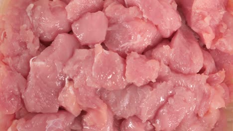 close-up view of raw, cubed pork